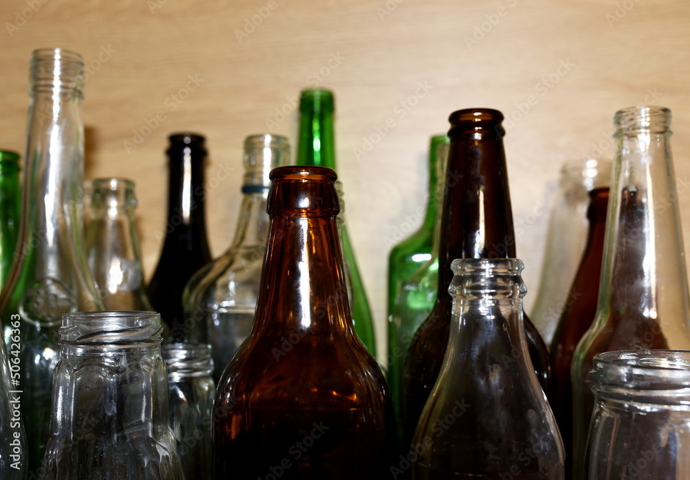 Glass waste for recycle. Empty glass bottles from beer wine and