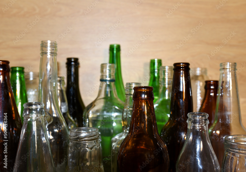 Glass waste for recycle. Empty glass bottles from beer wine and champagne. Ecology and
