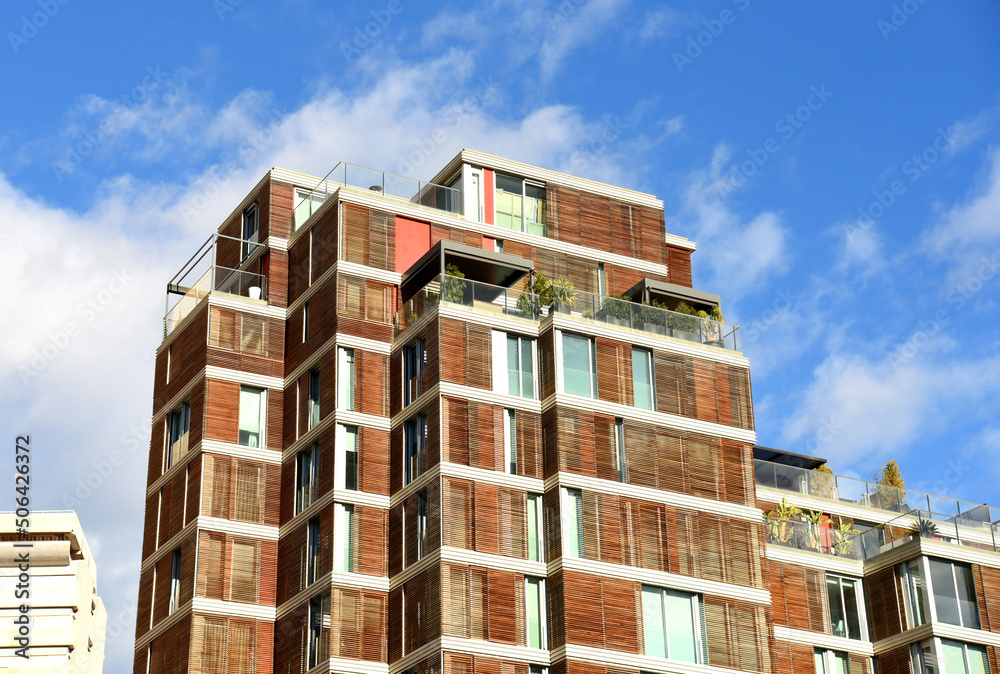 Facade building. Residential building with balconies. Colorful buildings and hotel apartments. Facade of residential building in Spain. House with window and balcony. Buildings architecture..