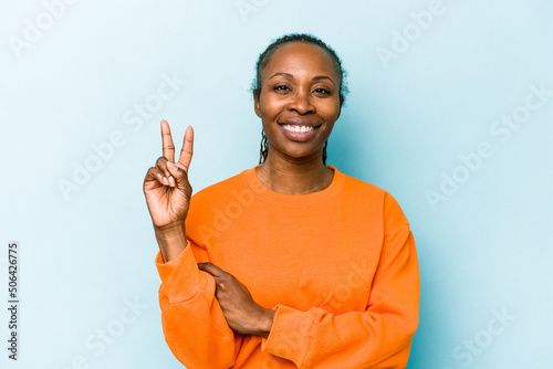 Young african american woman isolated on blue background showing number two with fingers.