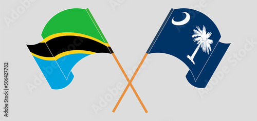 Crossed and waving flags of Tanzania and The State of South Carolina