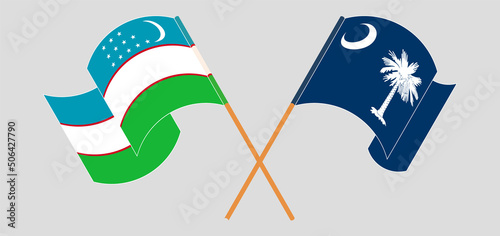 Crossed and waving flags of Uzbekistan and The State of South Carolina