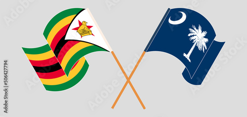 Crossed and waving flags of Zimbabwe and The State of South Carolina