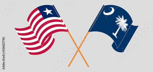 Crossed and waving flags of Liberia and The State of South Carolina