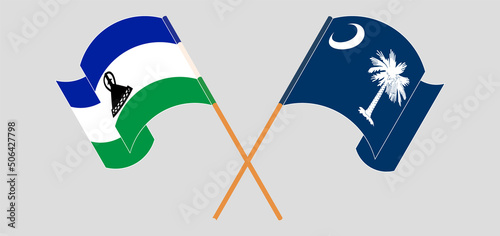 Crossed and waving flags of Lesotho and The State of South Carolina