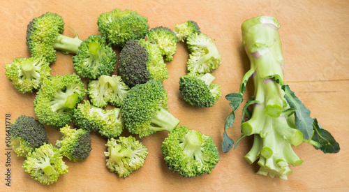 fresh broccoli barrel without inflorescences on wooden board