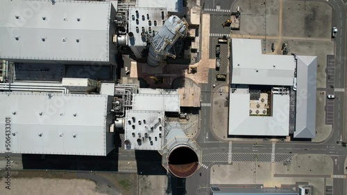 Drone overhead view looking down damaged chimney stacks Grain CHP Power station Kent UK photo