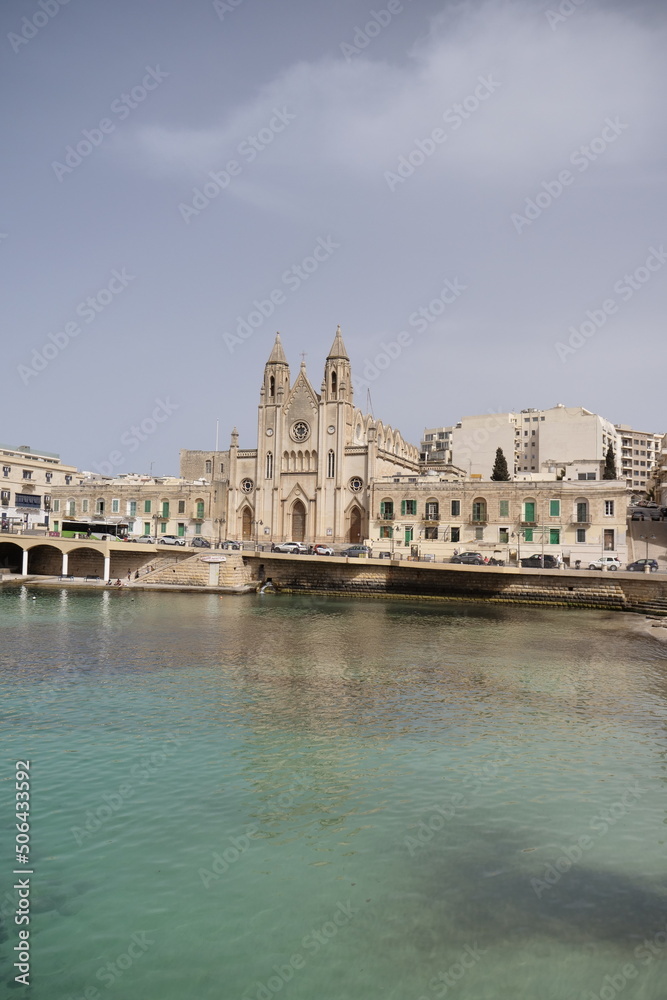 skyline of St Julians, Malta with the knisja tal-karmnu church on a sunny day