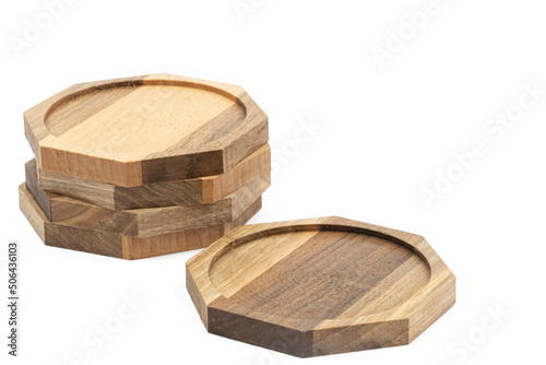 Octagon walnut wooden coasters isolated above white background