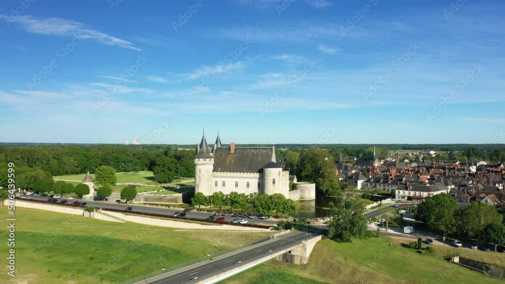 The castle of Sully in the middle of the countryside and the city in Europe, in France, in the Center region, in the Loiret, in summer, on a sunny day. The castle of Sully in the middle of the countryside and the city in Europe, in France, in the Center region, in the Loiret, in summer, on a sunny day.