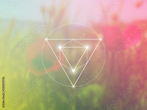Sacred geometry spiritual new age futuristic illustration with interlocking circles, triangles and glowing particles in front of blurry natural photographic background