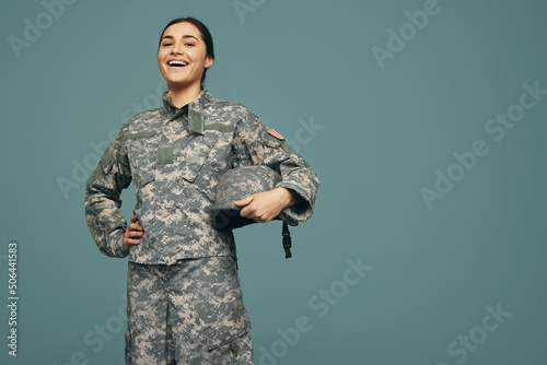 Cheerful female soldier smiling in a studio photo