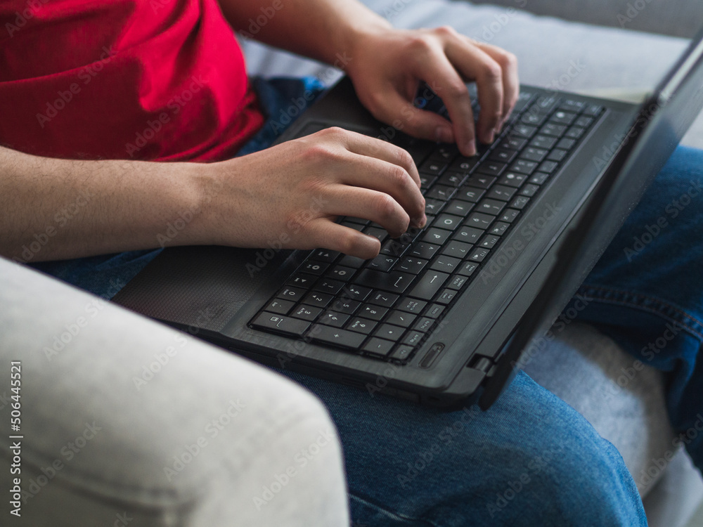 Faceless shot of Caucasian man with laptop. Work from home concept Faceless shot of Caucasian man with laptop. Work from home concept