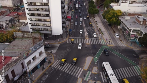 Aerial approaching view of vehicles diverting at intersection at Cordoba Avenue fork in Buenos Aires. Argentina. photo