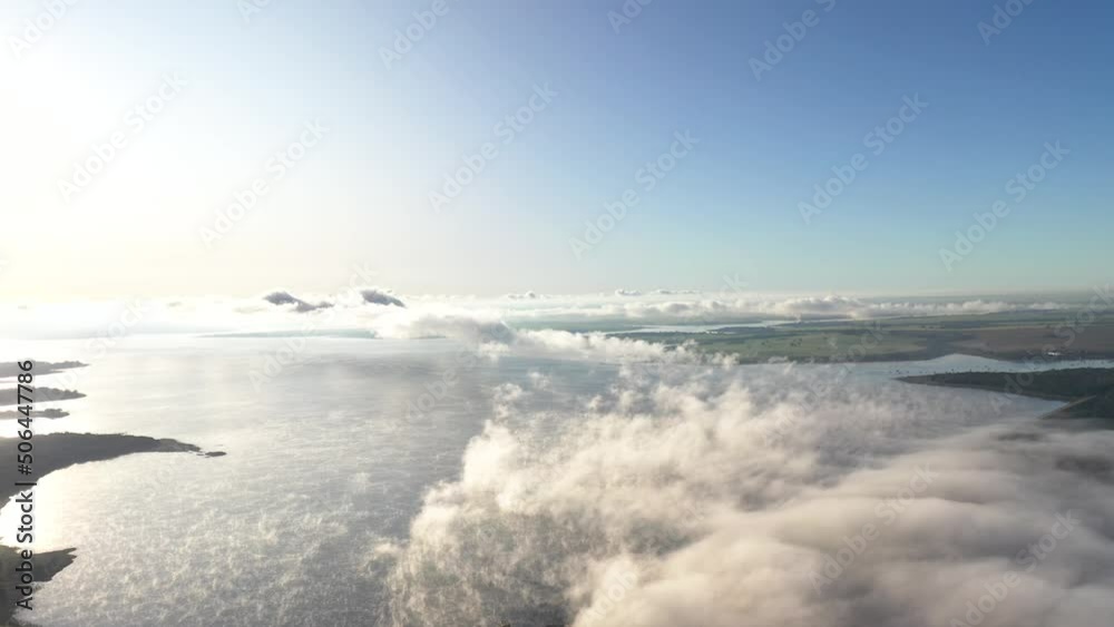 Aerial view of clouds over hydroelectric power plant pond, fog at dawn Aerial view of clouds over hydroelectric power plant pond, fog at dawn