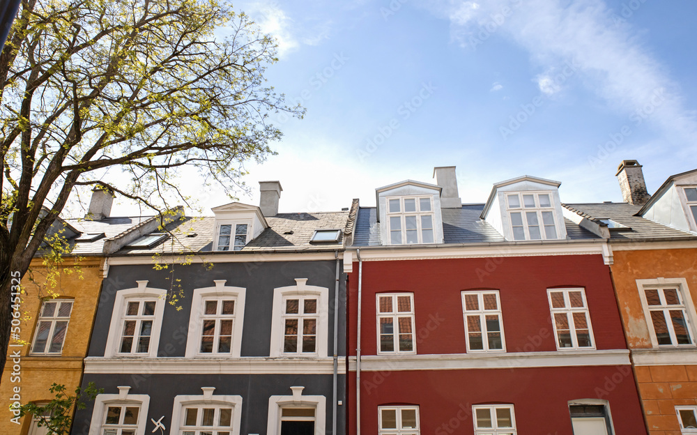  House facades in Copenhagen, Denmark. City street with old houses. Real estate investment. Expensive housing in the center of the city.
