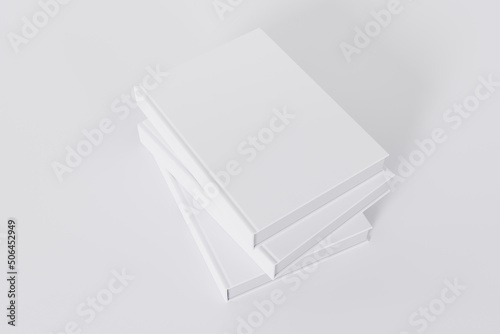 Mockup of a stack of rectangular books with a blank glossy covers on white background. Isolated with clipping path.