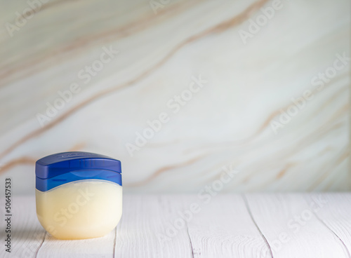 Big container of cream vaseline with copy space for text photo