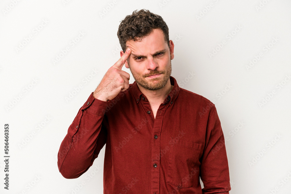 Young caucasian man isolated on white background pointing temple with finger, thinking, focused on a task. Young caucasian man isolated on white background pointing temple with finger, thinking, focused on a task.