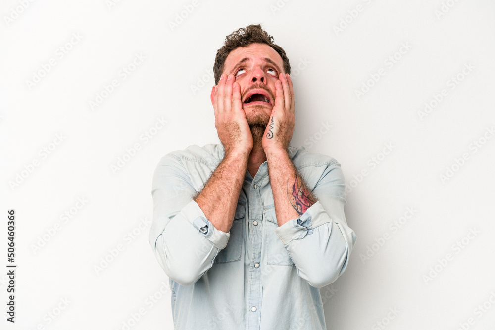 Young caucasian man isolated on white background whining and crying disconsolately. Young caucasian man isolated on white background whining and crying disconsolately.