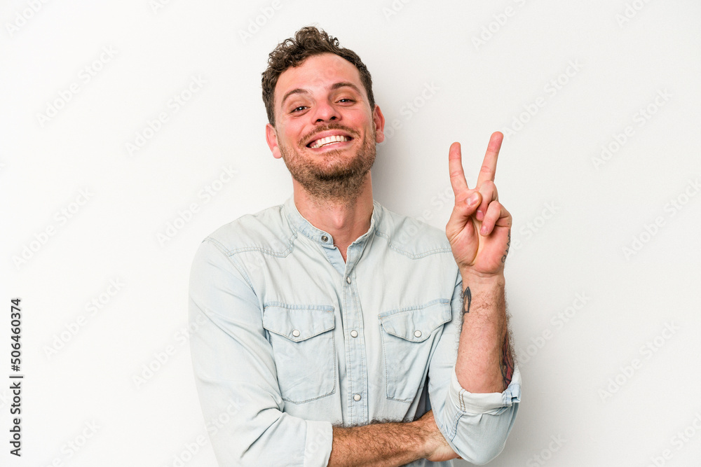 Young caucasian man isolated on white background showing number two with fingers. Young caucasian man isolated on white background showing number two with fingers.