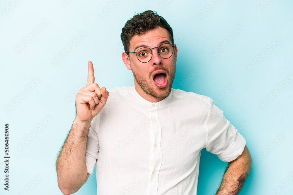 Young caucasian man isolated on blue background having an idea, inspiration concept. Young caucasian man isolated on blue background having an idea, inspiration concept.