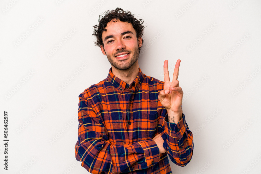 Young caucasian man isolated on white background showing number two with fingers. Young caucasian man isolated on white background showing number two with fingers.