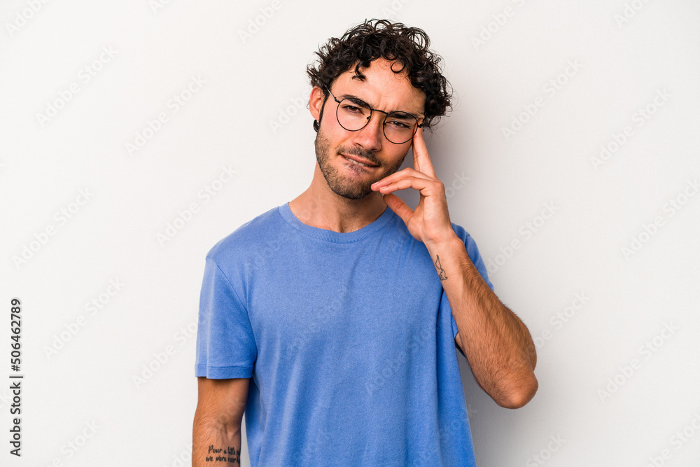 Young caucasian man isolated on white background pointing temple with finger, thinking, focused on a task. Young caucasian man isolated on white background pointing temple with finger, thinking, focused on a task.