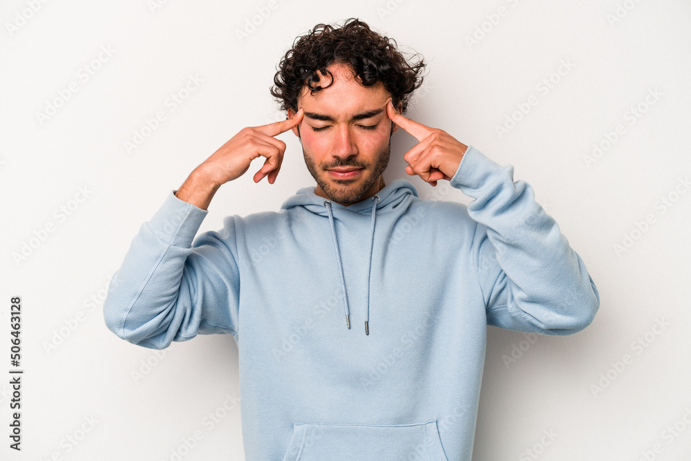 Young caucasian man isolated on white background focused on a task, keeping forefingers pointing head. Young caucasian man isolated on white background focused on a task, keeping forefingers pointing head.