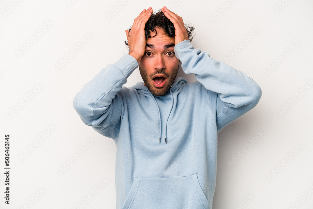 Young caucasian man isolated on white background surprised and shocked. Young caucasian man isolated on white background surprised and shocked.
