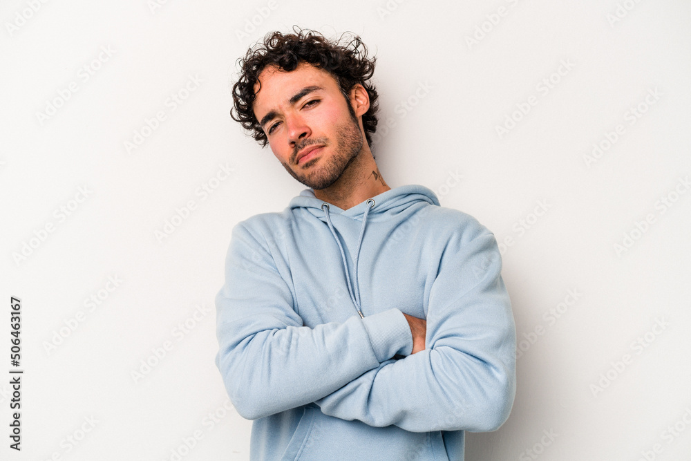 Young caucasian man isolated on white background tired of a repetitive task. Young caucasian man isolated on white background tired of a repetitive task.