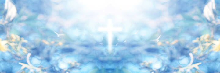 A cross in the middle of a blurry flower garden is like God Jesus in the heavenly realm known as the Garden of Eden in Christian faith.