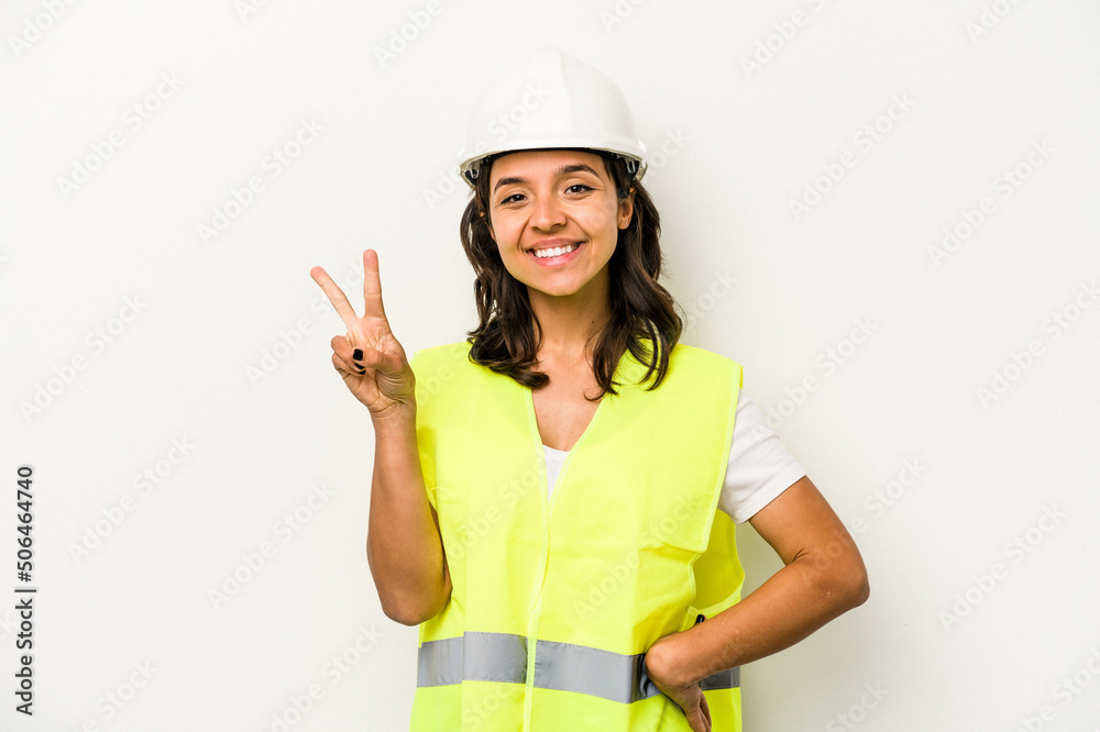 Young laborer hispanic woman isolated on white background showing number two with fingers. Young laborer hispanic woman isolated on white background showing number two with fingers.