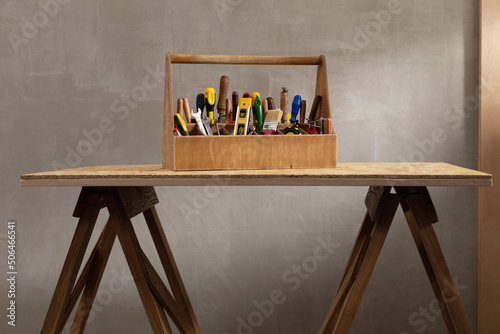 Construction tools and toolbox at wooden table background texture. Tools kit and tool box photo