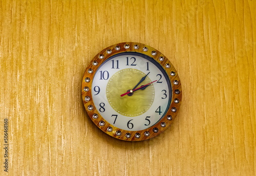 Wallpaper Mural Wall clock close-up on the background of the wallpaper of the room wall Torontodigital.ca