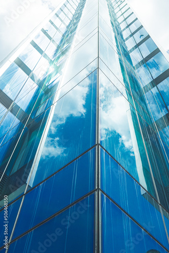 underside panoramic and perspective view to steel blue glass high rise building skyscrapers