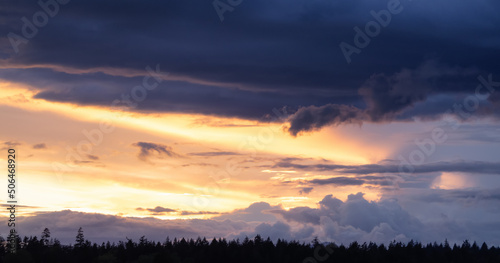 View of Cloudscape during a colorful sunset or sunrise. Taken on the West Coast of British Columbia  Canada. Nature Background