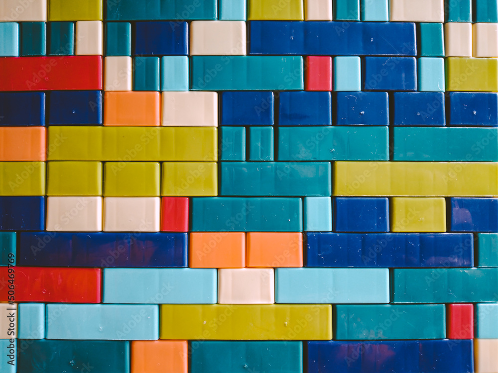 Colorful brick wall made from plastic building blocks Colorful brick wall made from plastic building blocks