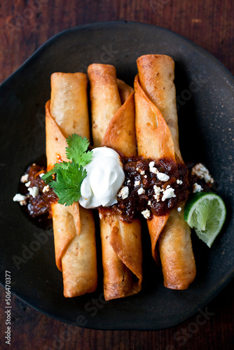 Flautas with Mole and Sour Cream photo