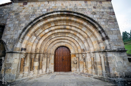 Portada de la fachada oeste de la Colegiata de Santa Maria de Castañeda (siglo XII). Socobio, Cantabria, España photo