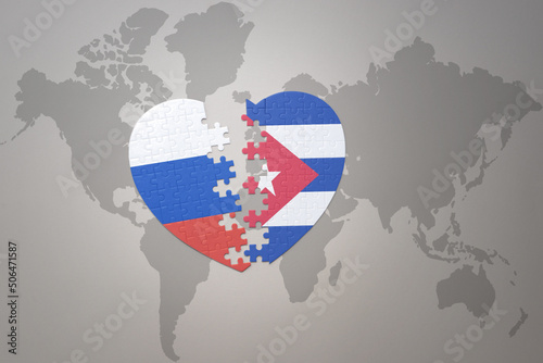 puzzle heart with the national flag of russia and cuba on a world map background. Concept.