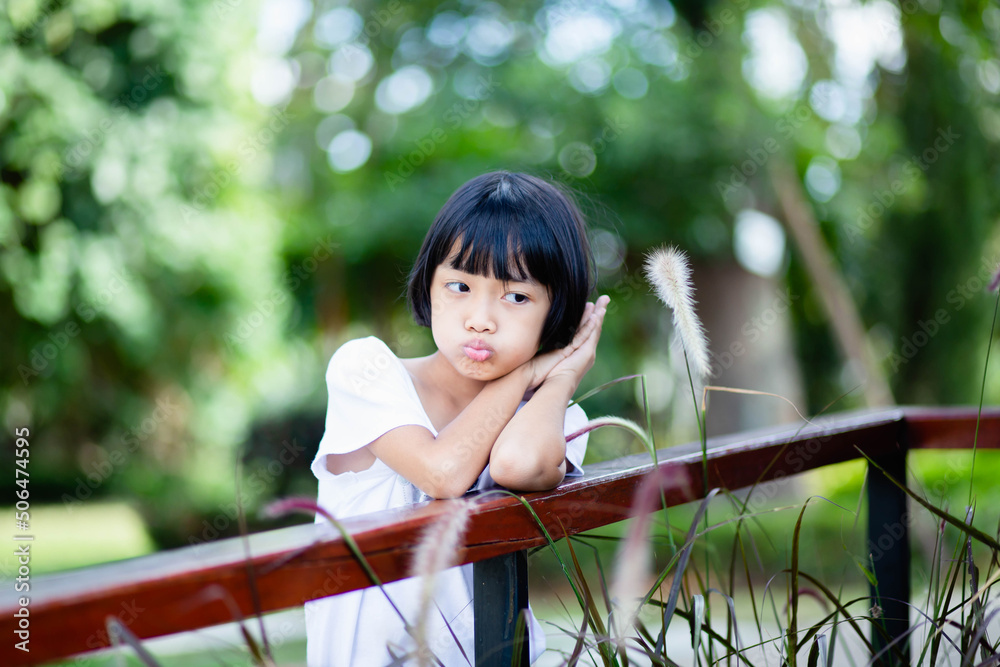 Naklejka premium girl walking in the park happy bright cheerful white dress blue skirt