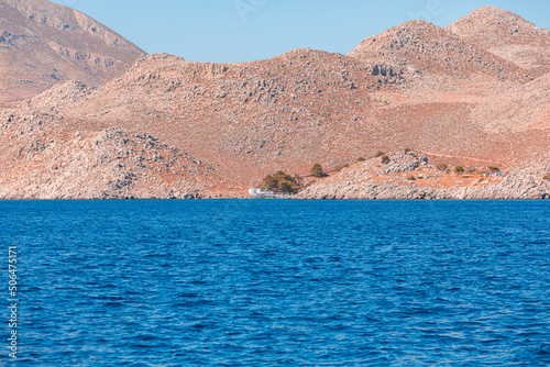 View of the island from the sea from a passing ship, Greece.