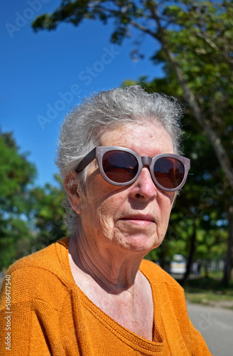Elderly woman on sunglasses in the sunbathing, Rio © Wagner Campelo