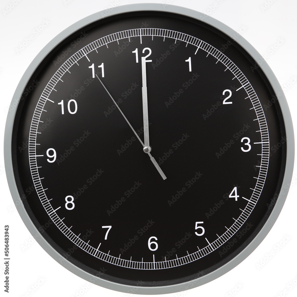 Wall clock showing twelve o'clock isolated on white background Wall clock showing twelve o'clock isolated on white background