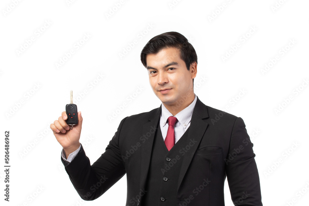 Portrait of a confident business man in black suit feeling happy and smile holding the keys of the car isolated on white background. Portrait of a confident business man in black suit feeling happy and smile holding the keys of the car isolated on white background.
