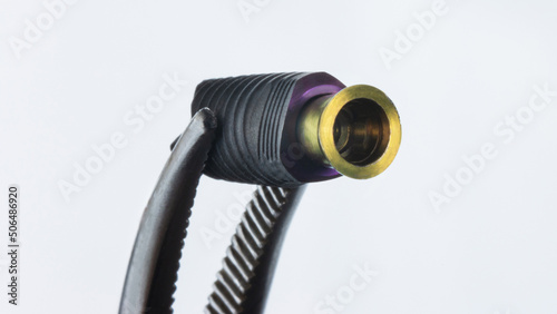 Photos macro photo of a dental implant with an abutment on a white background