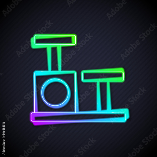 Glowing neon line Cat scratching post with toy icon isolated on black background. Vector