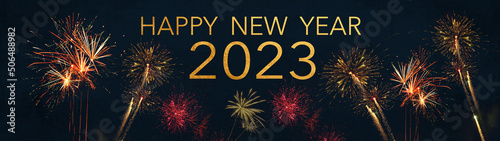 HAPPY NEW YEAR   NEW YEAR S EVE 2023 Silvester Party Celebration background banner panorama long greeting card - Golden red firework ion dark night sky.