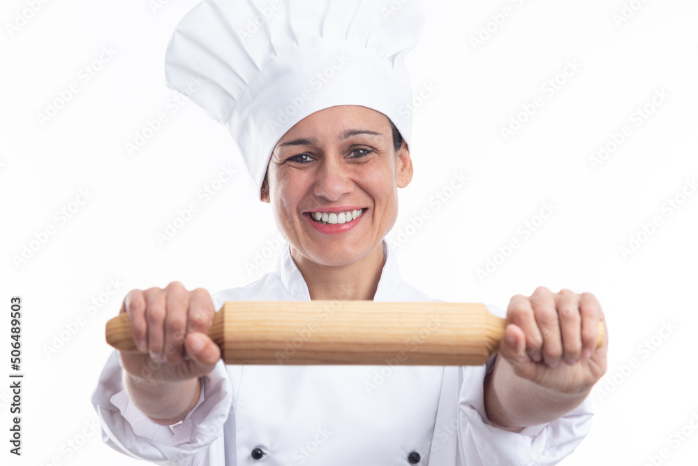 Happy caucasian woman dressed as chef showing kitchen utensil looking at camera isolated on white background. Happy caucasian woman dressed as chef showing kitchen utensil looking at camera isolated on white background.